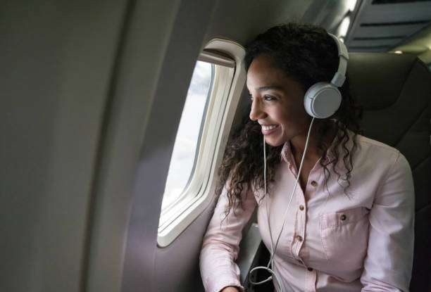 Girl listening to Audiobook on plane