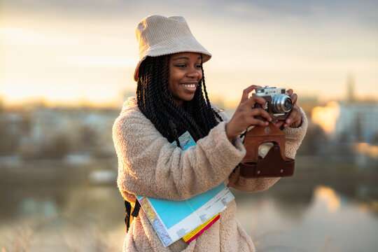 Black woman tourist in layers