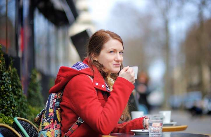 Woman at sidewalk cafe